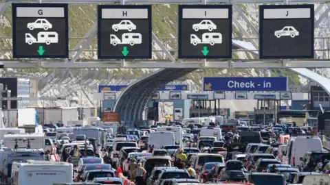 Dover suspends new EU border checks after queues top four hours