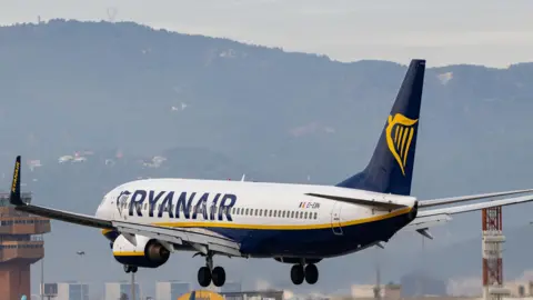 UK regulator investigates airline over charges for parents to sit with children
