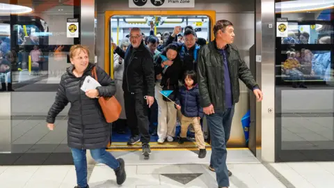 Australia Halves Fuel Tax, Offers Free Transit Amid War-Driven Price Surge