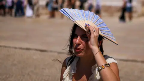 Europe swelters in early heatwave as records fall across region