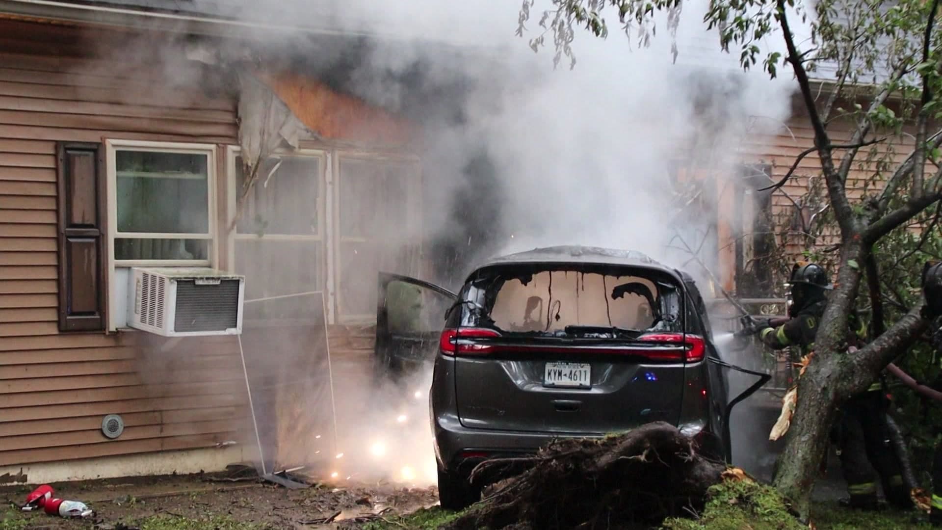 Vehicle crashes into Dix Hills home, sparks early-morning fire