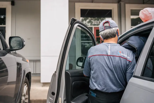 Why pizza chains still keep delivery in-house, and what it means for workers