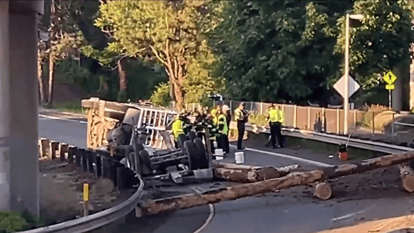 Rollover log truck closes key Eugene freeway ramp for hours