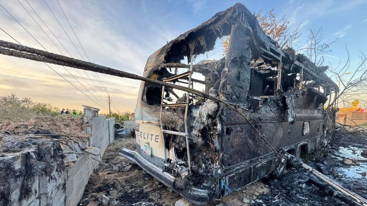 Burning RV plunges from overpass into Yuma backyard, crashes into tree
