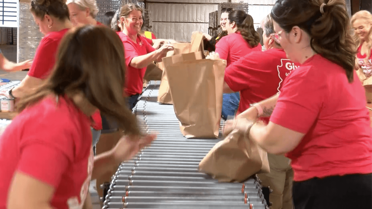Keller Williams Realty of Yuma volunteers at food bank for Red Day