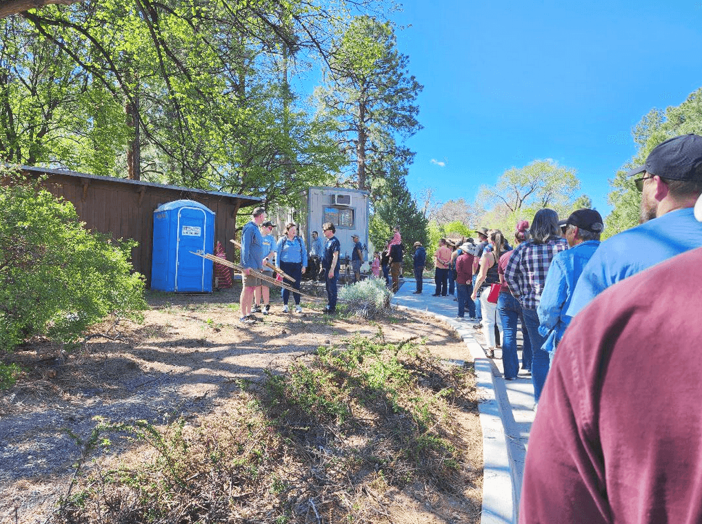 Residents line up for pieces of Oppenheimer House flooring in Los Alamos