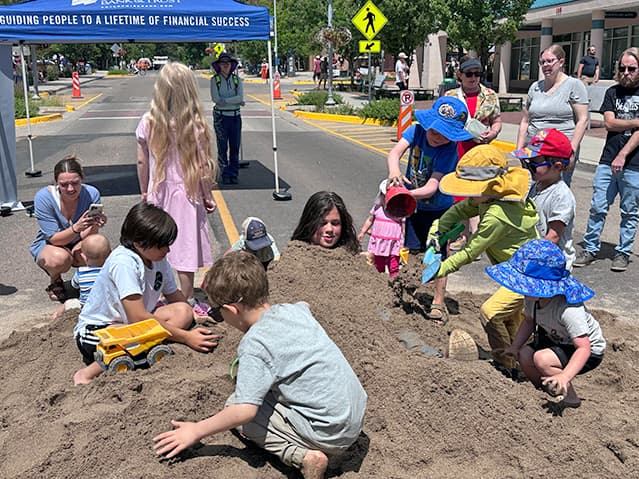 ChamberFest fills Central Avenue with sand pile, music and booths