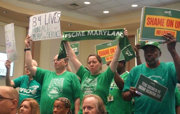 Baltimore protesters challenge University System layoffs, demand budget accountability