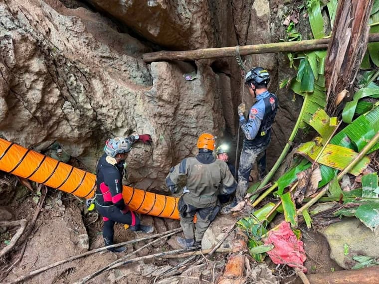 Four miners freed from Laos cave, two still missing after flooding