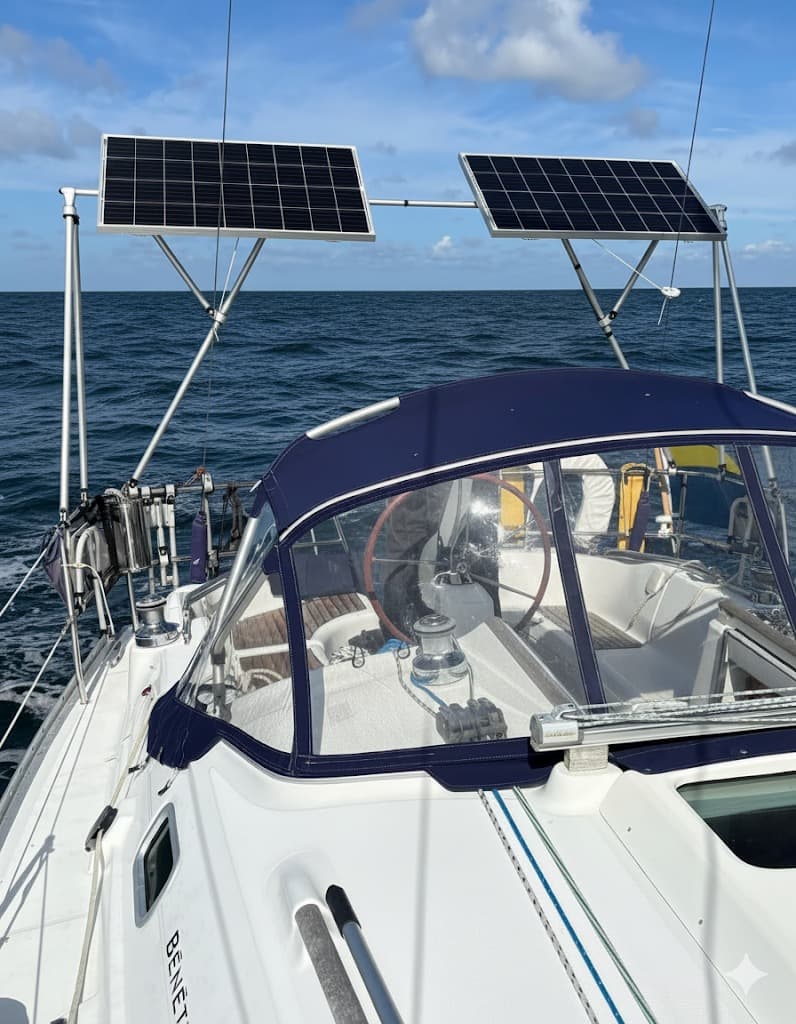Arch-mounted solar panels keep sailboat decks clear and charging strong