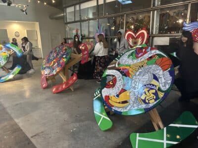 Van Go artists unveil World Cup picnic tables celebrating Lawrence