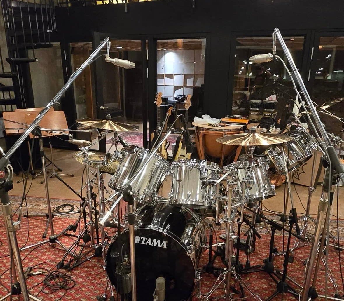Johan Koleberg helps Tobias Forge prep drum kit for new project