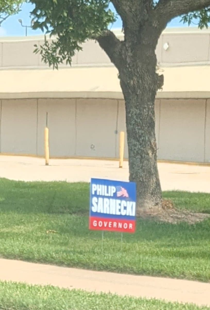 Resident reports illegal Philip Sarnecki signs on public property in Lawrence