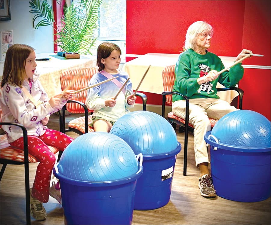 Girl Scouts share cardio drumming fun with Melrose Station seniors