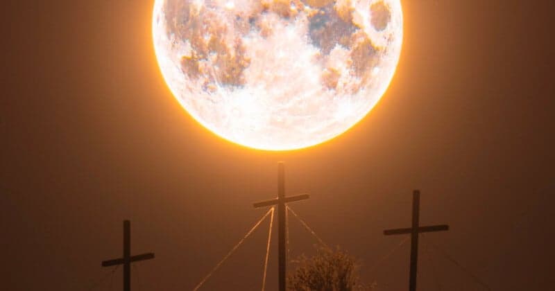 Photographer Captures Easter Full Moon Setting Behind Somerset's Three Crosses