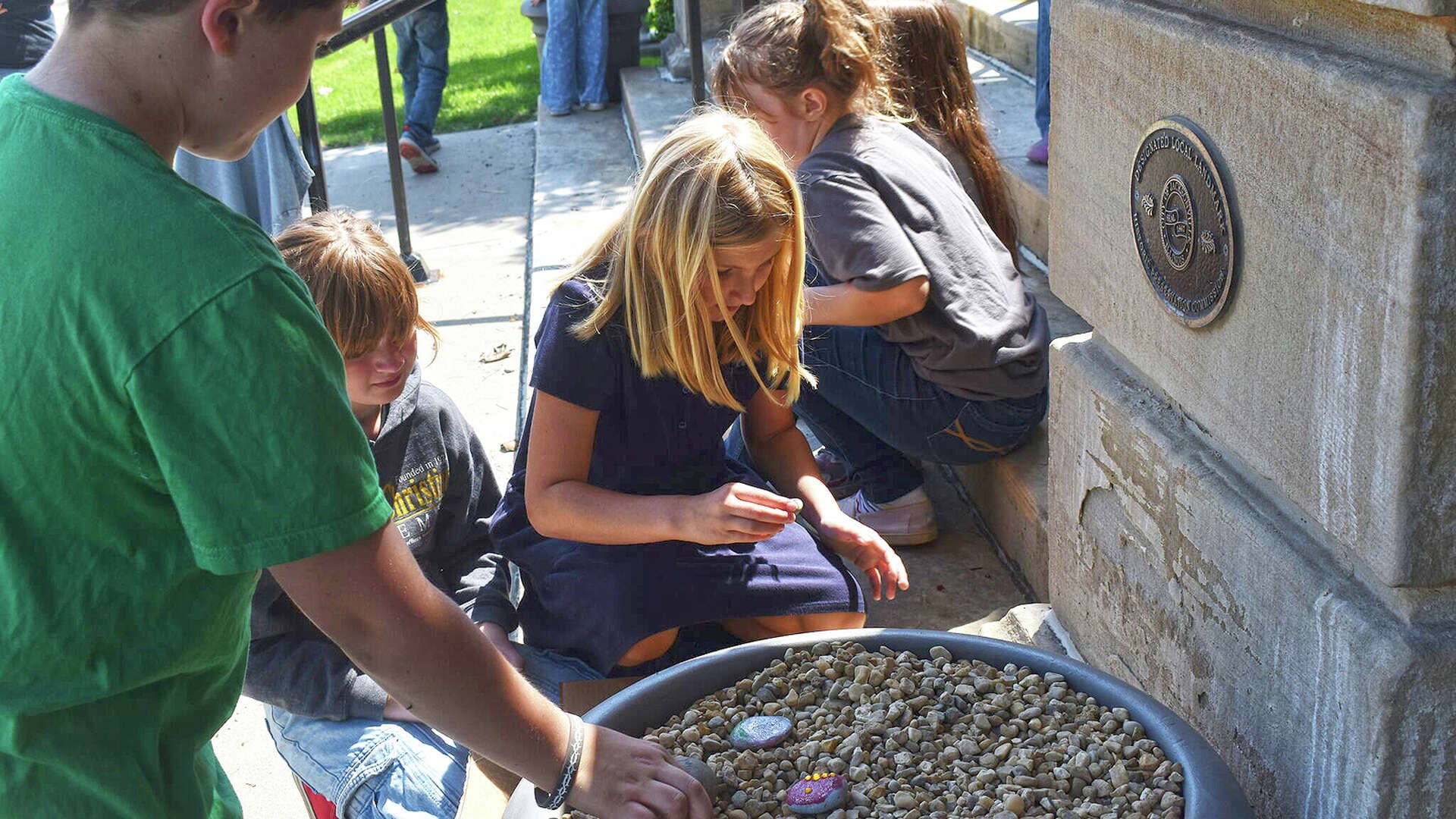 Westfair Christian Academy students create kindness rock garden at Jacksonville library