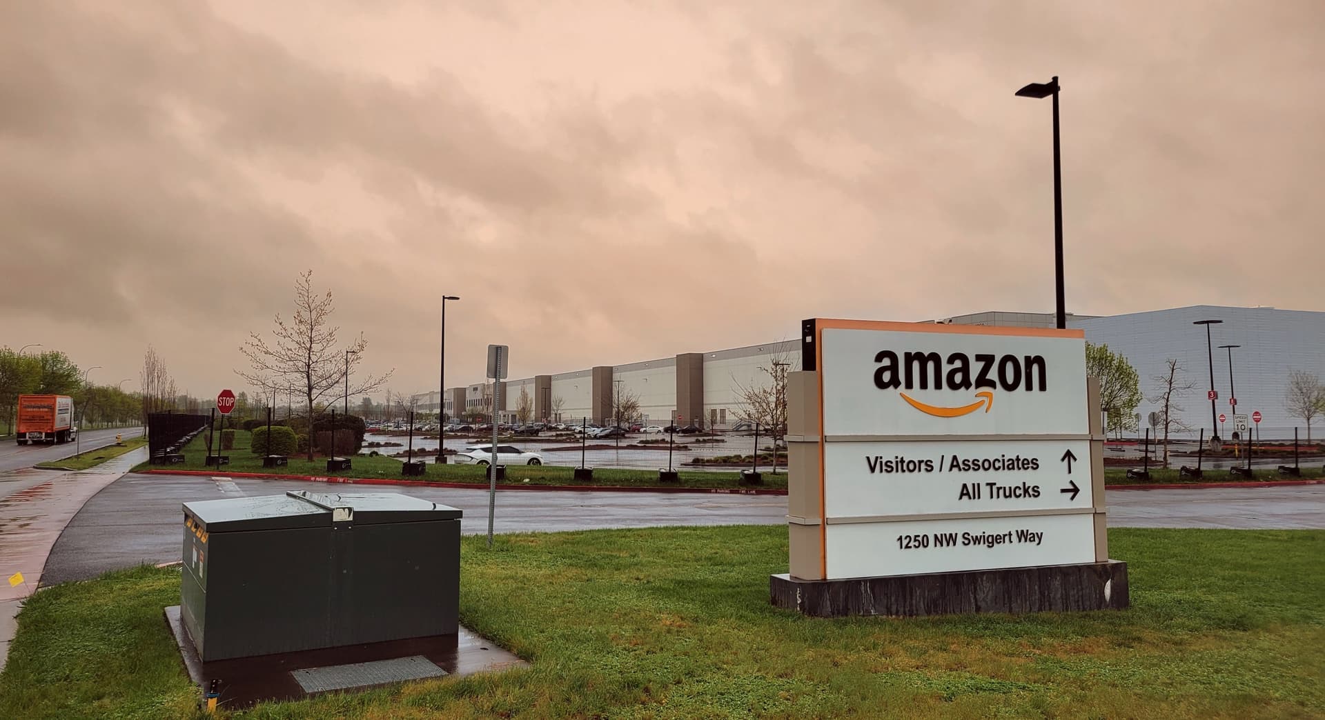 Amazon says Oregon warehouse death not work related, workers stunned