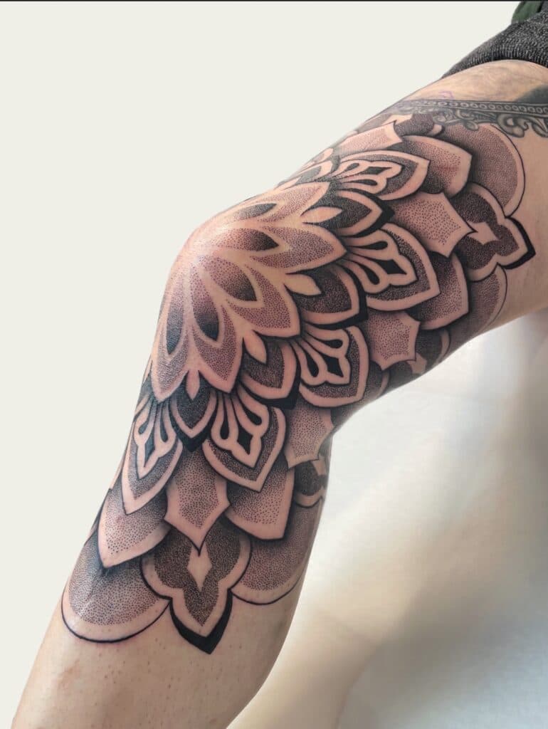 Dotwork geometric tattoos create depth through patient, precise ink density