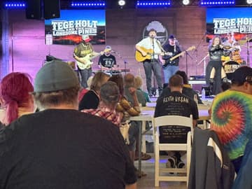 Rain moves Jacksonville concert indoors, crowd still turns out