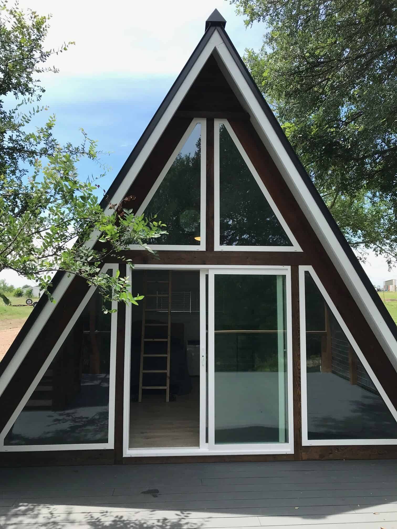 A-frame cabin in Texas ranch setting blends light, deck, and views
