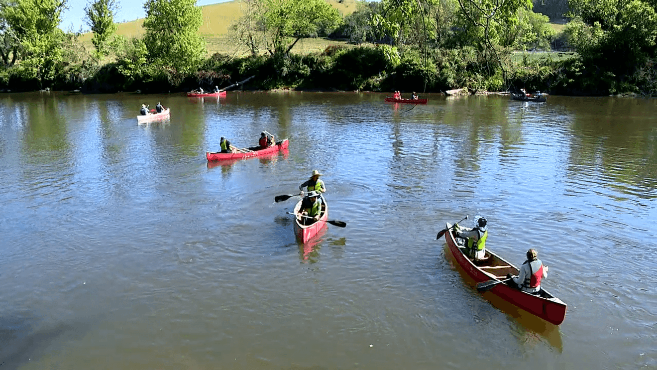 Earth Day volunteers clear Helene debris from French Broad River