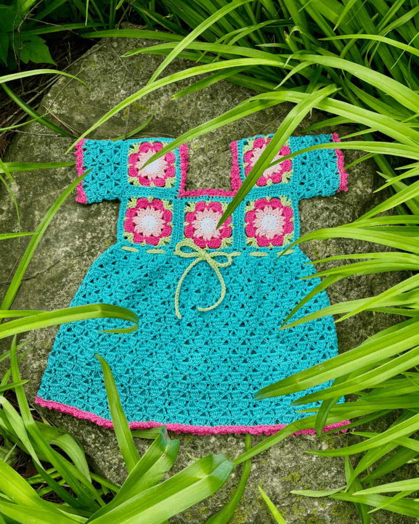 Gabriella Rose’s Island Girl baby dress blends tropical roots and family yarn