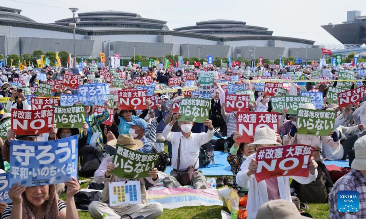 Tens of thousands protest Japan’s military buildup, defend pacifist constitution