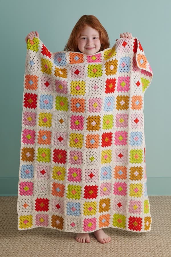Purl Soho’s Sunny Day Granny Square Blanket makes beginner crocheting easy